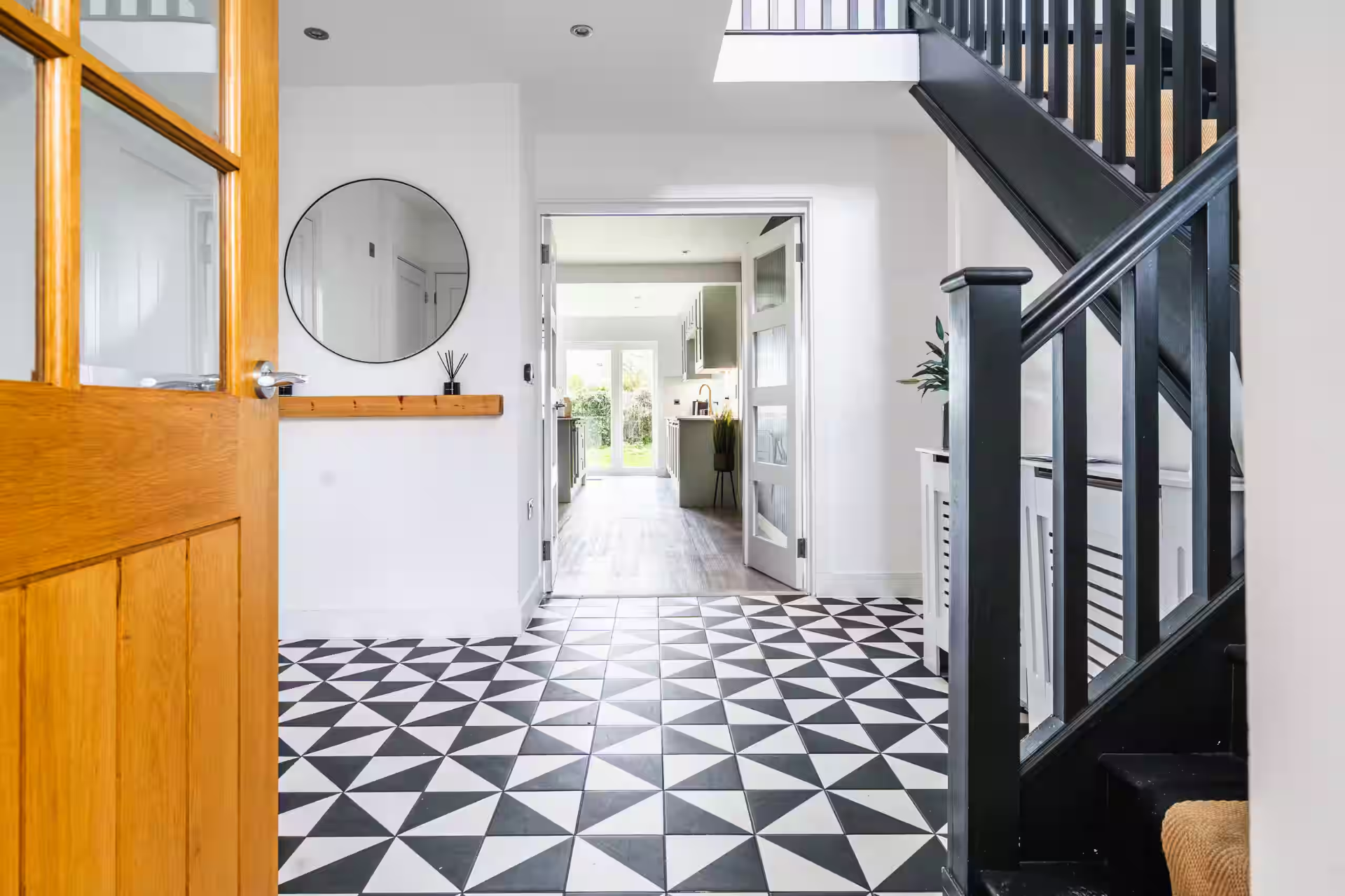 Bright entrance hall with patterned tile floor